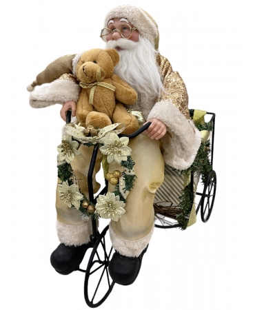 Санта на велосипеді іграшка 24 см.