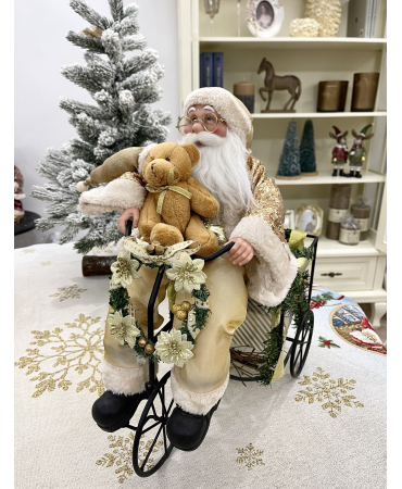 Санта на велосипеді іграшка 24 см.